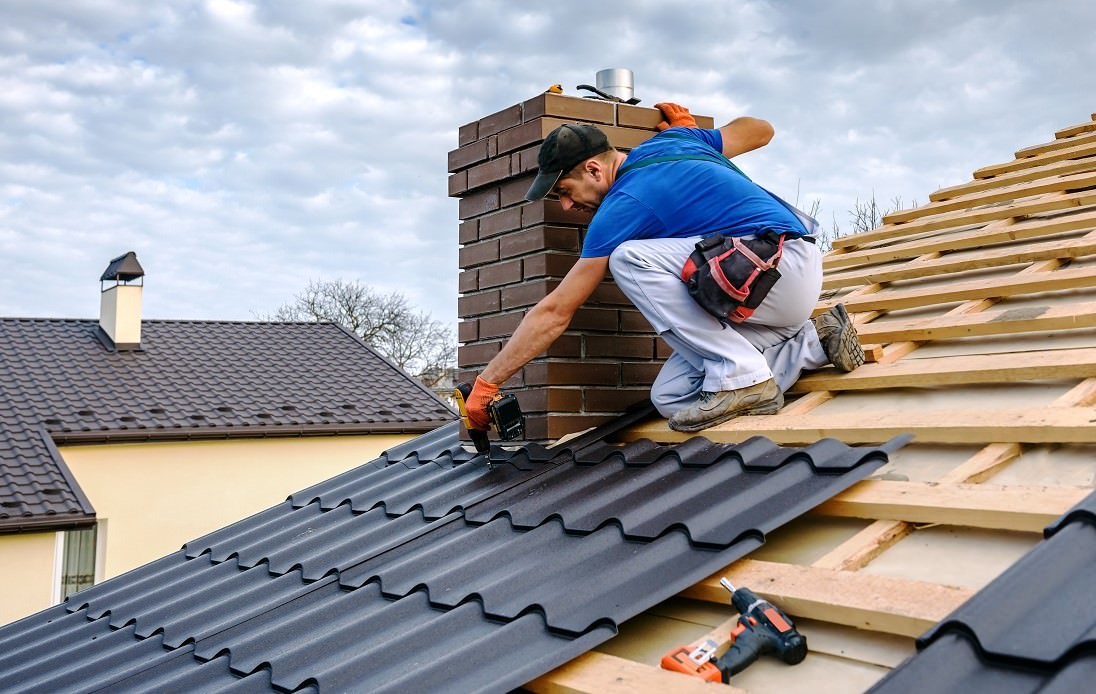 worker installing new roof